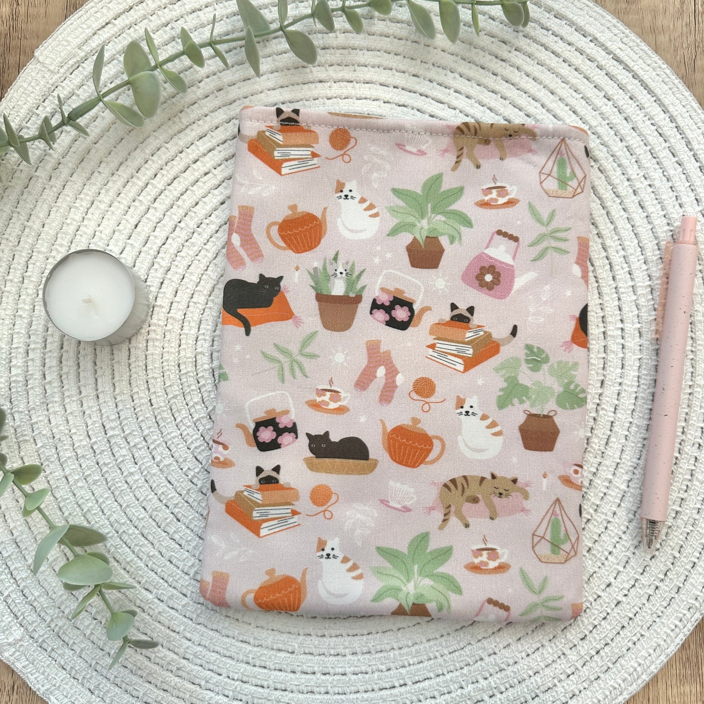 plant- and cat-patterned fabric sleeve for e-reader