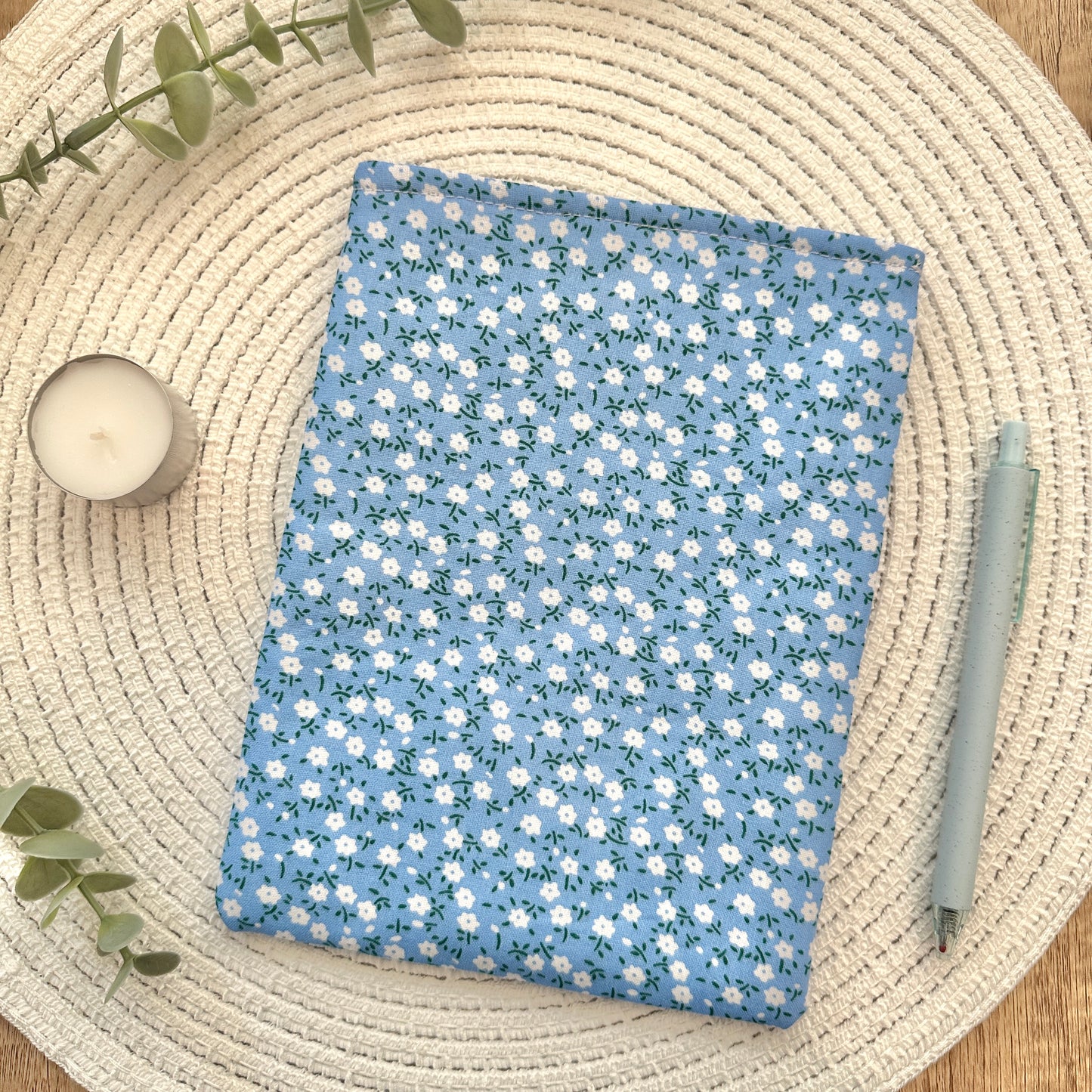 floral ereader sleeve on woven mat