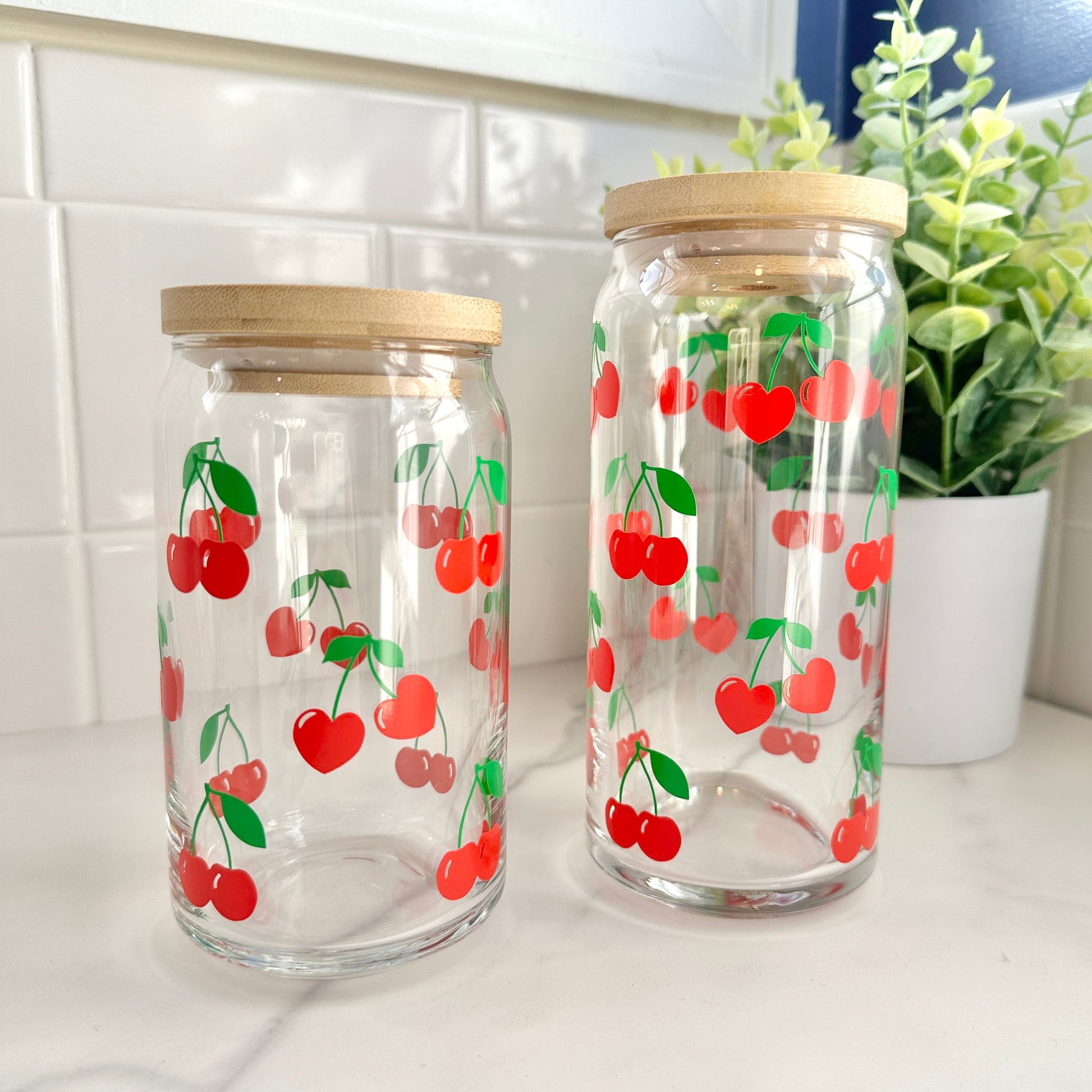 glass cups with cherry design on kitchen counter