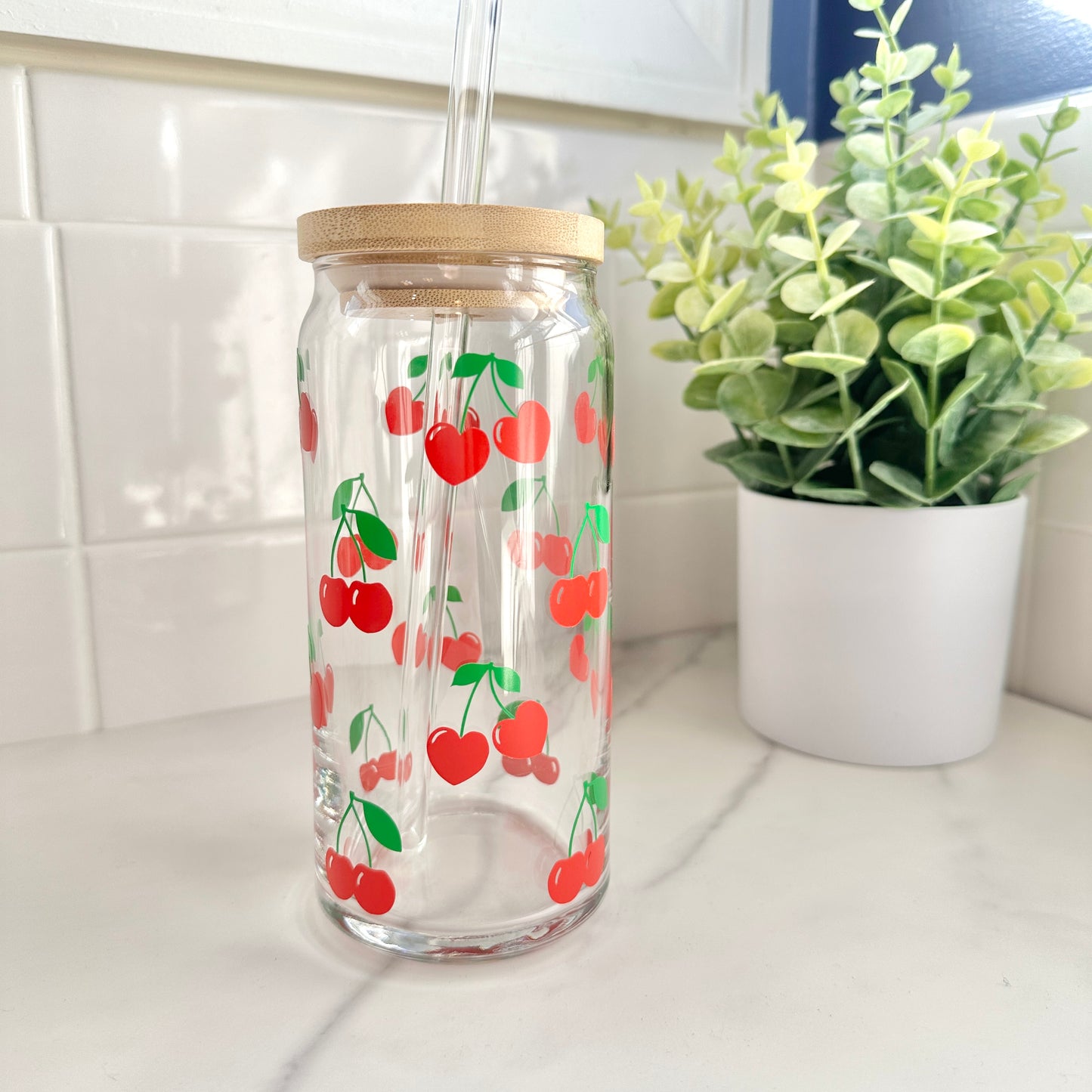 20-ounce iced coffee glass cup with lid and straw on kitchen counter