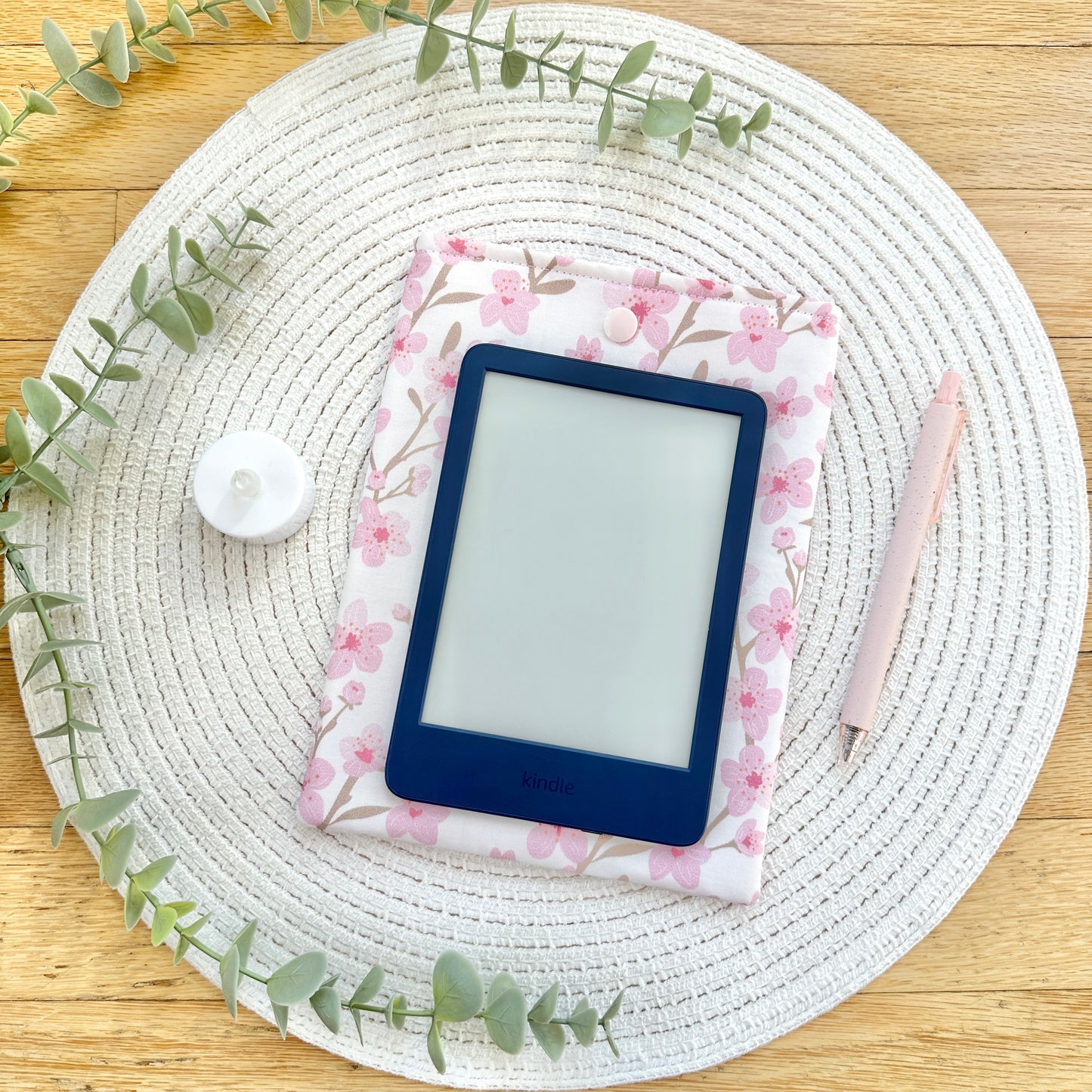 kindle on top of cherry blossom kindle case