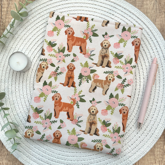 dogs and flowers book sleeve on woven mat