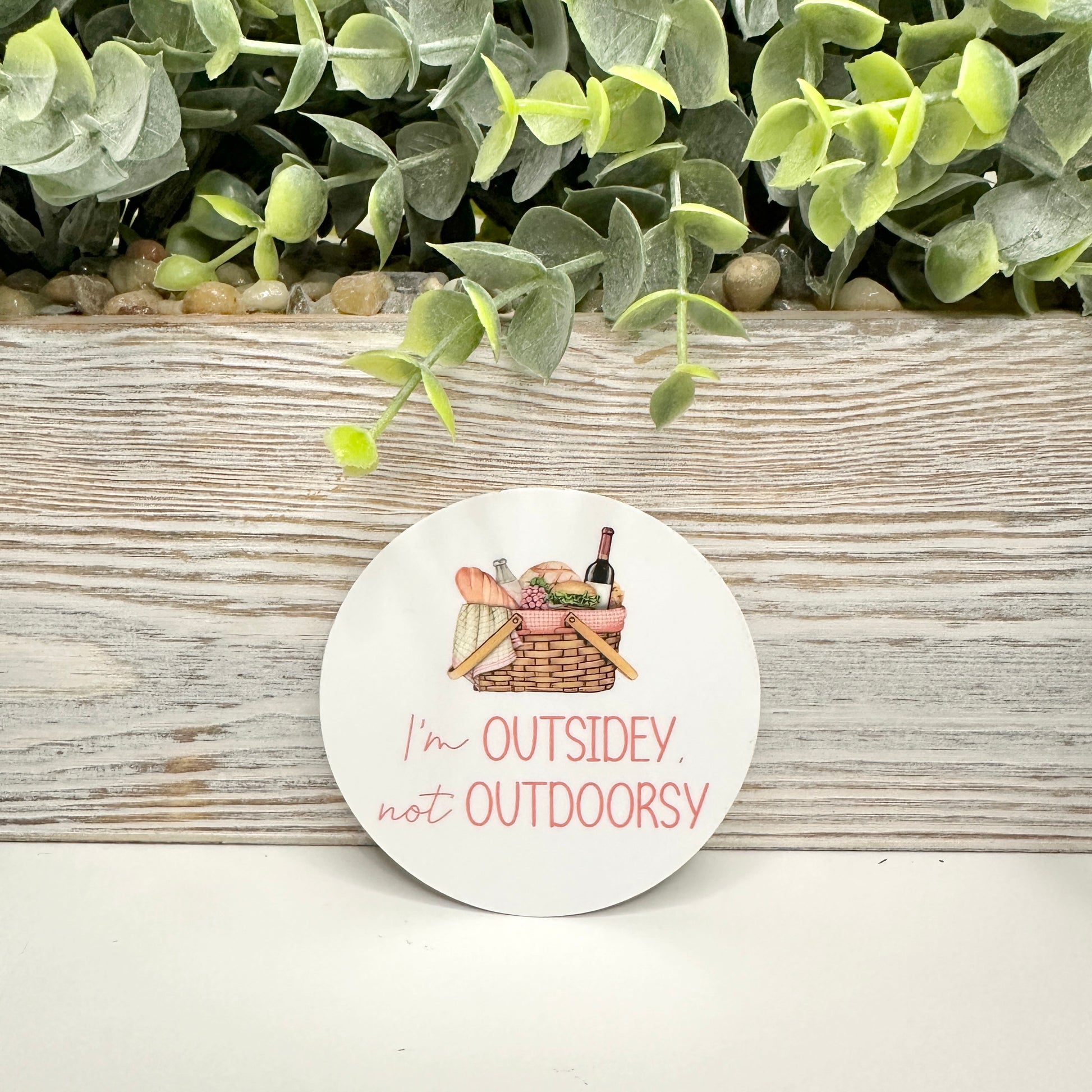 funny sticker for nature lovers in front of wood shelf