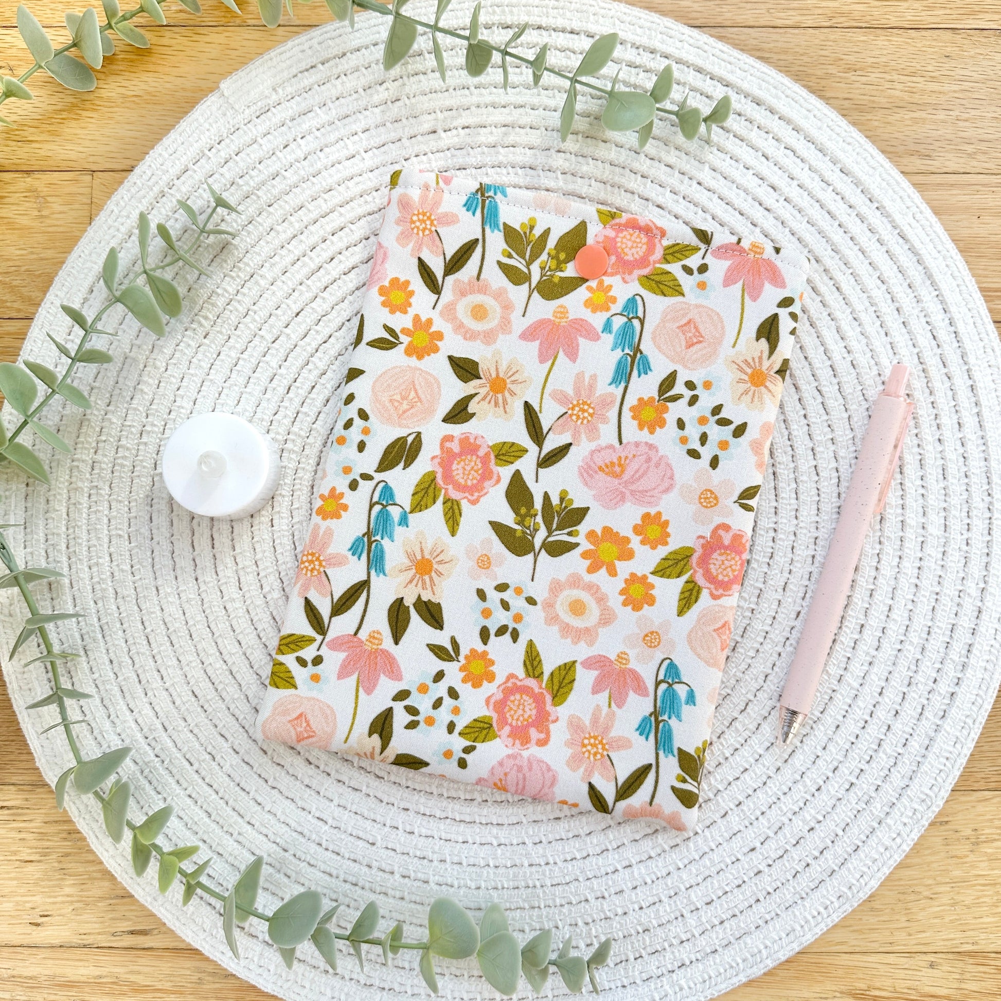 wildflower kindle sleeve on woven mat with decorative elements